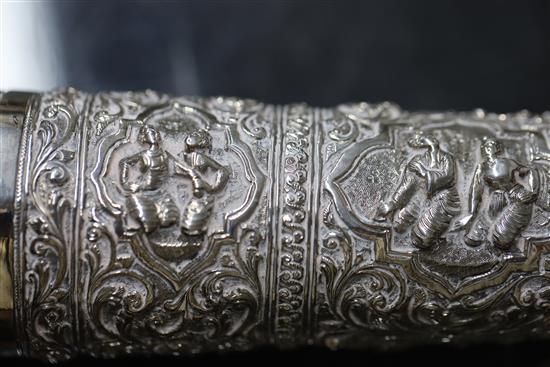 A Burmese embossed silver horn-shaped scroll holder and cover on hardwood stand, 41.5cm